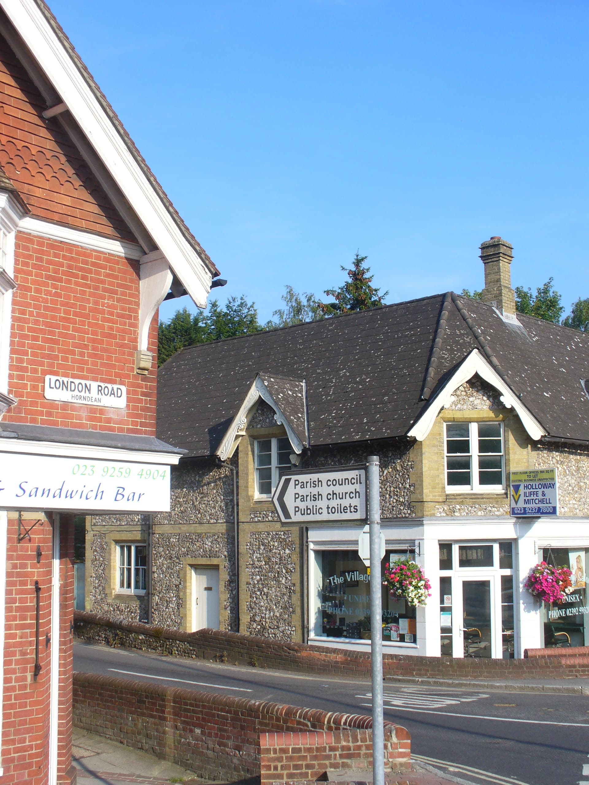 London Road, Horndean — village shops and the parish council direction sign